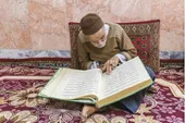 تقدیم سومین قرآن دست نویس به آستان قدس