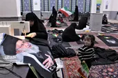 دوخت&zwnj;ودوز بانوان بالاخیابان برای سیاه&zwnj;پوش کردن محله